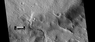 Channel that has cut through a crater rim, as seen by HiRISE under HiWish program