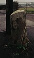 A milestone near Busbie Farm.