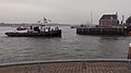 The national arrival of Sinterklaas in Maassluis, tugboat (de Tonijn) with Zwarte Pieten