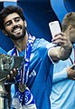 Luís Neto takes a selfie with the trophy after the triumph