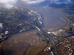 Aerial view of the Silver Jubilee Bridge and the two towns of Runcorn (left) and Widnes (right)