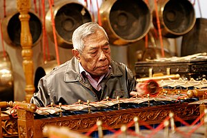 Traditional Indonesian Gamelan instrument being played by Bapak Sugito of the Indonesian Embassy in Australia