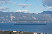 View of Trizonia island as seen from Peloponnese. (outlined with a black line)