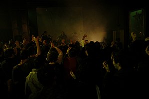 Rock band performing live in Cacilhas, O Culto bar in front of an audience