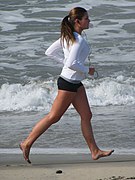 Woman runnng barefoot