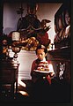 Young girl, Kimu, carrying a birthday cake through the Lachung Monastery, Sikkim February 1969.