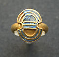 Gold finger ring with lapis lazuli inlays in the shape of a double axe