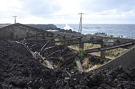 Ruin of a school gym engulfed in a lava flow of 1983