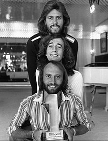 The Bee Gees in 1977 (top to bottom): Barry, Robin and Maurice Gibb