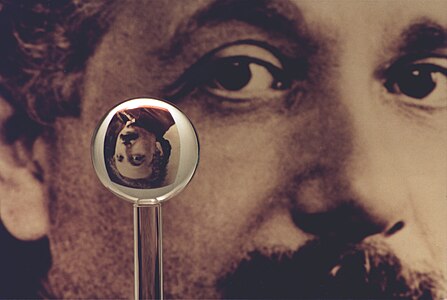 An image of one of the most accurate human-made spheres, as it refracts the image of Einstein in the background. This sphere was a fused quartz gyroscope for the Gravity Probe B experiment, and differs in shape from a perfect sphere by no more than 40 atoms (less than 10 nm) of thickness. It was announced on 1 July 2008 that Australian scientists had created even more nearly perfect spheres, accurate to 0.3 nm, as part of an international hunt to find a new global standard kilogram.[22]
