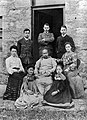 1907 Kang in group picture with her father and others