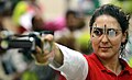 Olfa Charni wearing shooting glasses with a semi-transparent occluder for the non-aiming eye competing in a 10 m air pistol event.