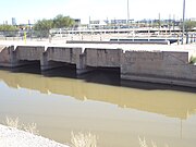 The overflow release on the Grand Canal. Built in 1878, it is located near the end of 48th Street on a parcel owned by the City of Phoenix.