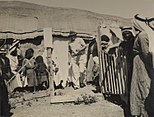 Malaria clinic, 1938 (Dr. Gideon Mer in the centre with hat)