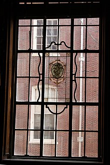 Printers' Mark on a window in the Main Library.