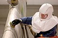 Scuff sanding a KC-10 aircraft, before painting