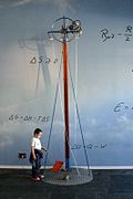 A child interacting with a lariat chain in The Hall of Matter