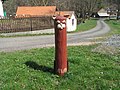 Wooden sculpture of a cat at the village square