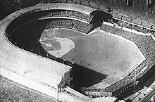 Photograph from the sky showing a baseball stadium.