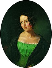 Portrait of a young lady. She is wearing a dress under a coat. She is looking to the left, somewhat smiling.