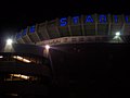 The front of the stadium at night