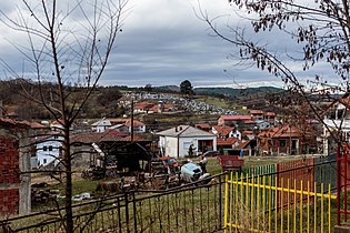 Црквата со селските гробишта погледната од селото