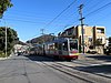 A train passing the future site of Ulloa and 14th Avenue station in February 2019