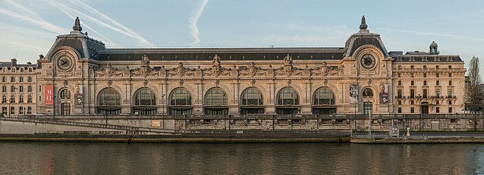 Beaux Arts Doric pilasters on the façade of the Gare d'Orsay, Paris, designed by Victor Laloux in c.1896-1897, and built in 1898-1900[28]