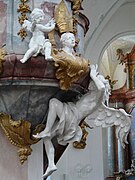 An angel carrying the pulpit