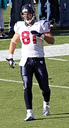 A football player walking on a football field