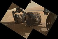 Wheels on Curiosity - Aeolis Mons is in the background (MAHLI, September 9, 2012).
