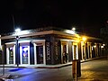 A bouncer stands guard outside a downtown Ponce lounge