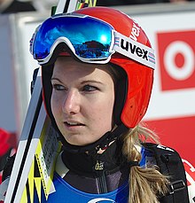 A skier wearing a helmet and goggles