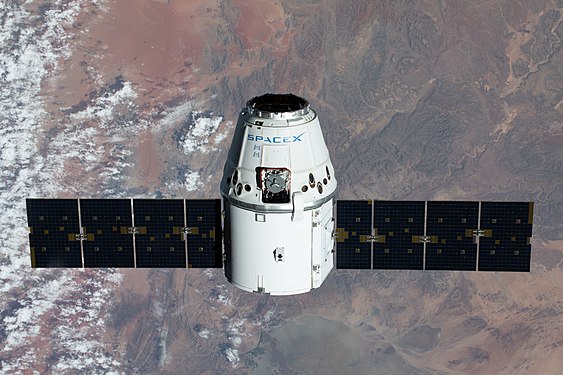 SpaceX Dragon resupply ship of mission CRS-20 approaching the International Space Station over Namibia by NASA Johnson Space Center, edited by Nythar