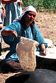 An old Kurdish woman makes bread in traditional Kurdish way of baking, Photo 1991