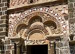 Blind polylobed arch above the door of the Romanesque chapel of Saint-Michel-d’Aiguilhe in Le Puy-en-Velay, France (10th–11th century)