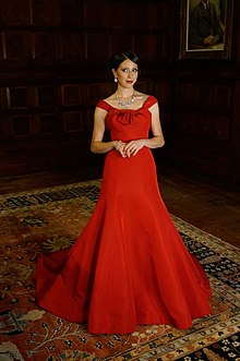 Oropesa in a red dress by Austin Scarlett