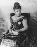 Queen Kapiʻolani wearing her peacock feathered dress