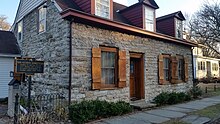 a picture of the marker an stone house