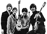 The Beatles (consisting of John Lennon, Paul McCartney, George Harrison, and Ringo Starr) released music throughout the 1960s, and are often considered the most popular band in global history. Beatlemania was/is the fanaticism surrounding The Beatles. The Beatles experienced intense fan worship during the '60s era.