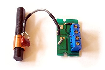 LC circuit (left) consisting of ferrite coil and capacitor used as a tuned circuit in the receiver for a radio clock