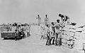 Soldiers construct aircraft revetments at RAF Ta Kali, Malta, using locally quarried limestone blocks, c. 1942