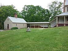 Looking North-West. Kitchen and Laundry building on the West end of the Main House at Sully. Kitchen is connected by a covered walkway.