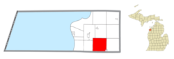 Location within Benzie County (red) and an administered portion of the Thompsonville village (pink)