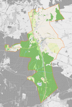 Mapa konturowa Woźnik, blisko centrum na prawo u góry znajduje się punkt z opisem „Parafiaśw. Katarzyny Aleksandryjskiej”