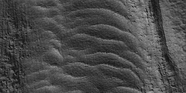 Close view of tongue-shaped glacier, as seen by HiRISE under HiWish program. Surface is broken up into cubes.