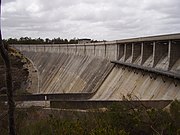 Dam wall and slip-way