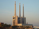 The three chimneys of the now closed Besòs thermal power station have become an icon for the city. In 2008, the citizens of Sant Adrià decided to keep them in a referendum.[15]