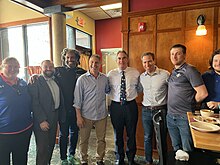 Mayor Sarno with Hartford, CT Mayor Luke Bronin, White Lion Brewery Owner Ray Berry, Tony Caputo, Owner of Red Rose Pizzeria, William Baker, Communications Director for City of Springfield and AHL Springfield Thunderbirds staff at Red Rose.