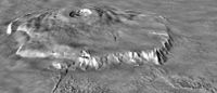 Oblique view of Olympus Mons, from a Viking image mosaic overlain on MOLA altimetry data, showing the volcano's asymmetry. The view is from the NNE; vertical exaggeration is 10×. The wider, gently sloping northern flank is to the right. The more narrow and steeply sloping southern flank (left) has low, rounded terraces, features interpreted as thrust faults. The volcano's basal escarpment is prominent.